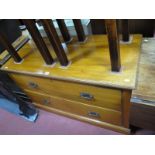 A Satin Walnut Chest of Drawers, with two long drawers on a plinth base.