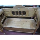A Pine Bench with Spindle Back, 'S' shaped ends, lift up seat, 118cm wide.