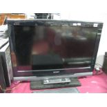 A Sony Bravia 26" Flat screen TV, with remote.