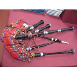 A Set of Early -Mid XX Century Bagpipes, with cylindrical wooden stems and tartan coloured bag,