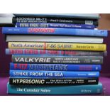 A Collection of Twelve Hardcover North American Military Aviation Themed Books, including The