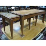 A Teak Nest of Tables, with rectangular tops on tapering legs.