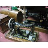 Two Singer Sewing Machines.