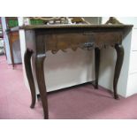 A Side Table, with a shaped apron, cabriole legs.