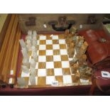 An Onyx and Mineral Chess Set and Board.