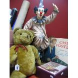 A Large Resin Model of a Clown on a Unicycle, 74cm high, a jointed golden plush teddy bear, a