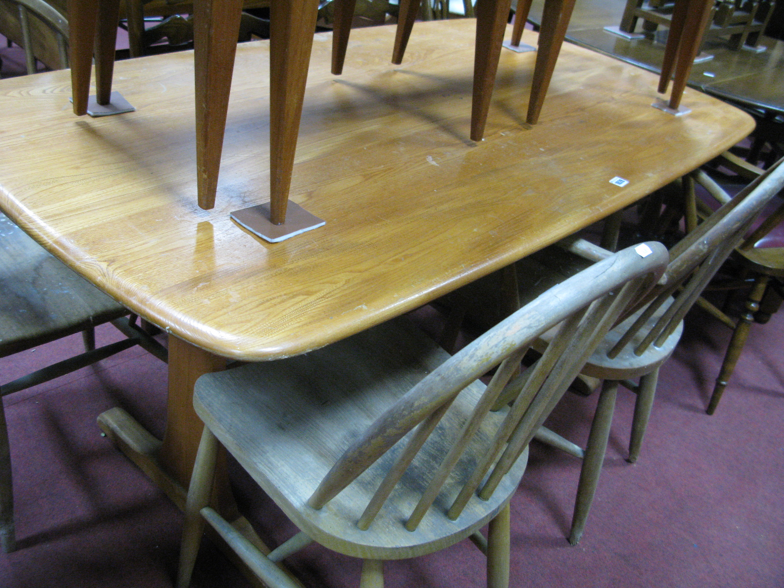 Ercol Light Ash Dining Table, with carved corners to rectangular top, on trestle supports, 152 x