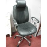 A Black Office Chair, with adjustable action on chromed five star base.`