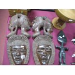 XX Century Pair of Carved African Face Masks; together with a African figure and bowl, supported