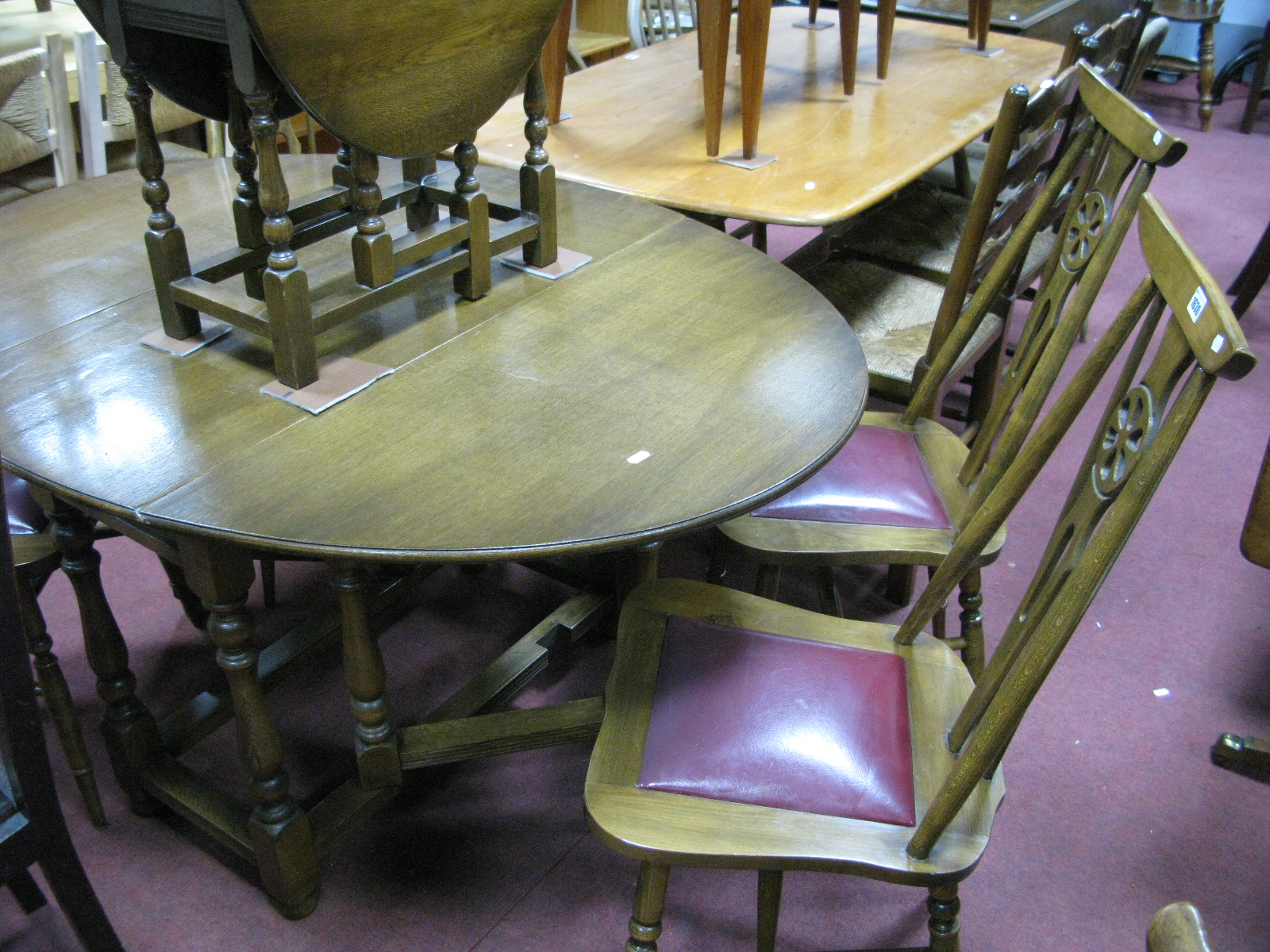 A XX Century Set of Four Ash Wheel Back Chairs, with drop in seats on turned legs, together with two