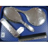 A Hallmarked Silver Backed Four Piece Dressing Table Set, with ribbon tied swag decoration. (4)