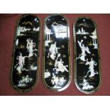 Three Chinese Style Oval Shaped Black Lacquer Wall Panels, with raised mother of pearl figures.