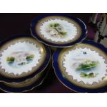 A XIX Century Continental Porcelain Part Dessert Service, painted with alpine scenes within gilt and