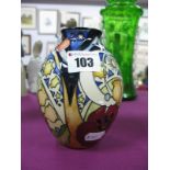 A Moorcroft Pottery Vase, painted with a design of with poppy leaves, bulbs, stars and plants,