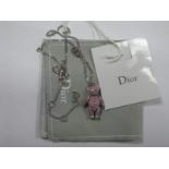 Christian Dior: A Modern Articulated Sparkly Pink Teddy Bear Pendant, on a curb link chain, in