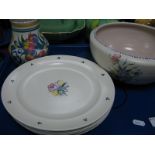 Six Poole Pottery Plates, each with stylized floral motif to centre, three green dot bunches to