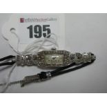 An Art Deco Ladies Diamond Set Cocktail Wrist Watch, the slim rectangular dial with Arabic numerals,