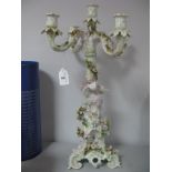 A Continental Dresden Style Ceramic Four Branch Candelabrum, with allover floral encrusting,