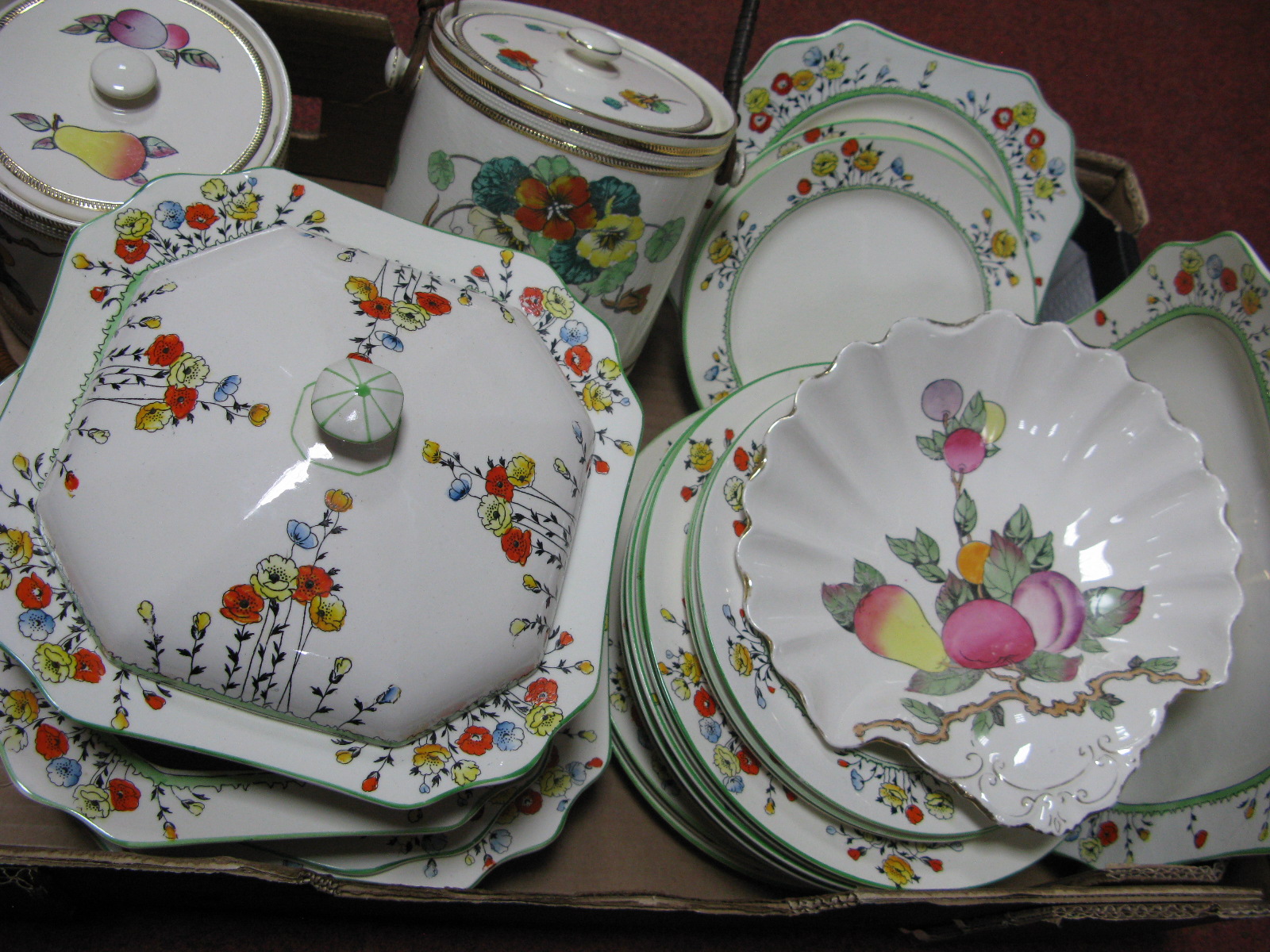 Crown Devon 'Poppy' Dinner Ware of twenty pieces, 'Autumn' and 'Nasturtium' biscuit barrels,