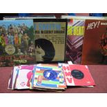 A Mixed Collection of LP's and 45RPM's, to include Sgt Pepper; Please Please Me; Rolling Stone 1st