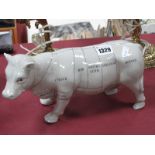 Pottery Model of a Cow, with butchers cuts to body, 29cm long.