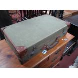 A Green Hessian Suitcase, with leather corner mounts.