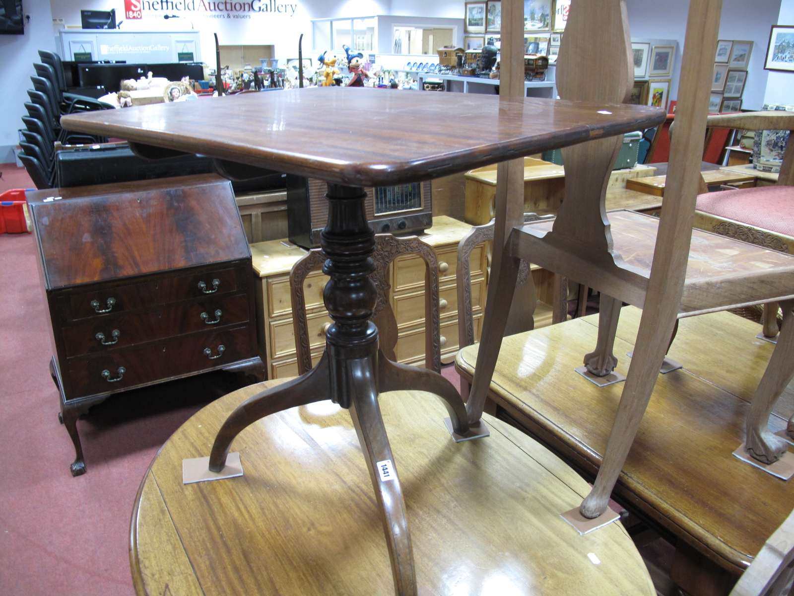 A XIX Century Mahogany Pedestal Table, with snap action to rectangular top on turned stalk and