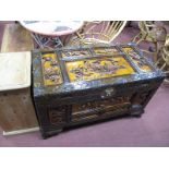 A Chinese Style Blanket Box, with a carved panel top, carved panel base, with brass lock plate, on
