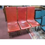 Three Circa Mid XX Century Elm Easy Chairs, with red studded leather upholstery.