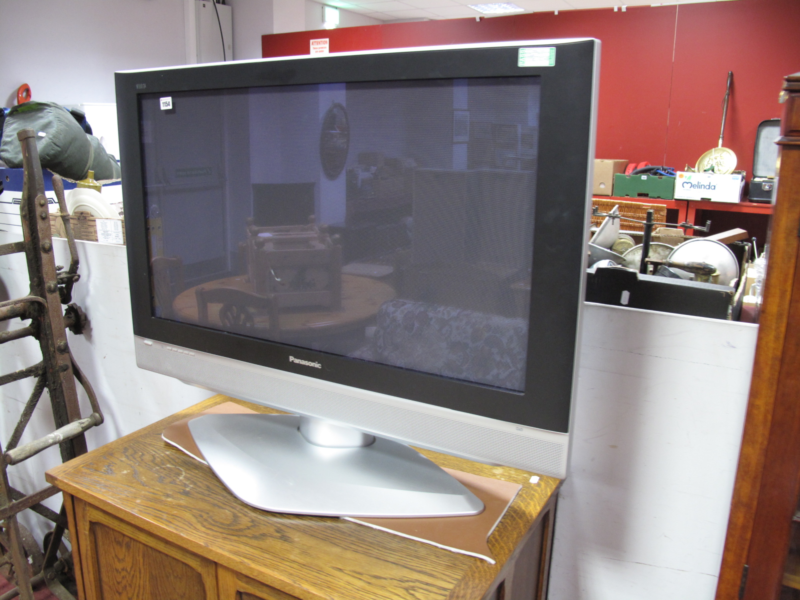 A Panasonic Plasma TV Model No TY-ST42PA50W together with an oak TV cabinet.