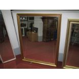 A Rectangular Gilt Shaped Wall Mirror, with bevelled glass.