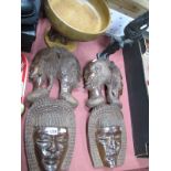 XX Century Pair of Carved African Face Masks; together with an African figure and bowl, supported by