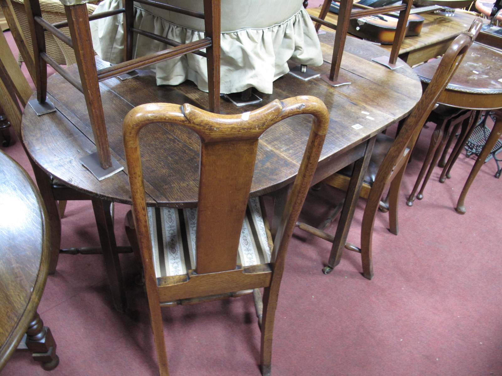 A Set of Four Oak Queen Ann Style Dining Chairs, with drop ins eats on cabriole legs, (4);