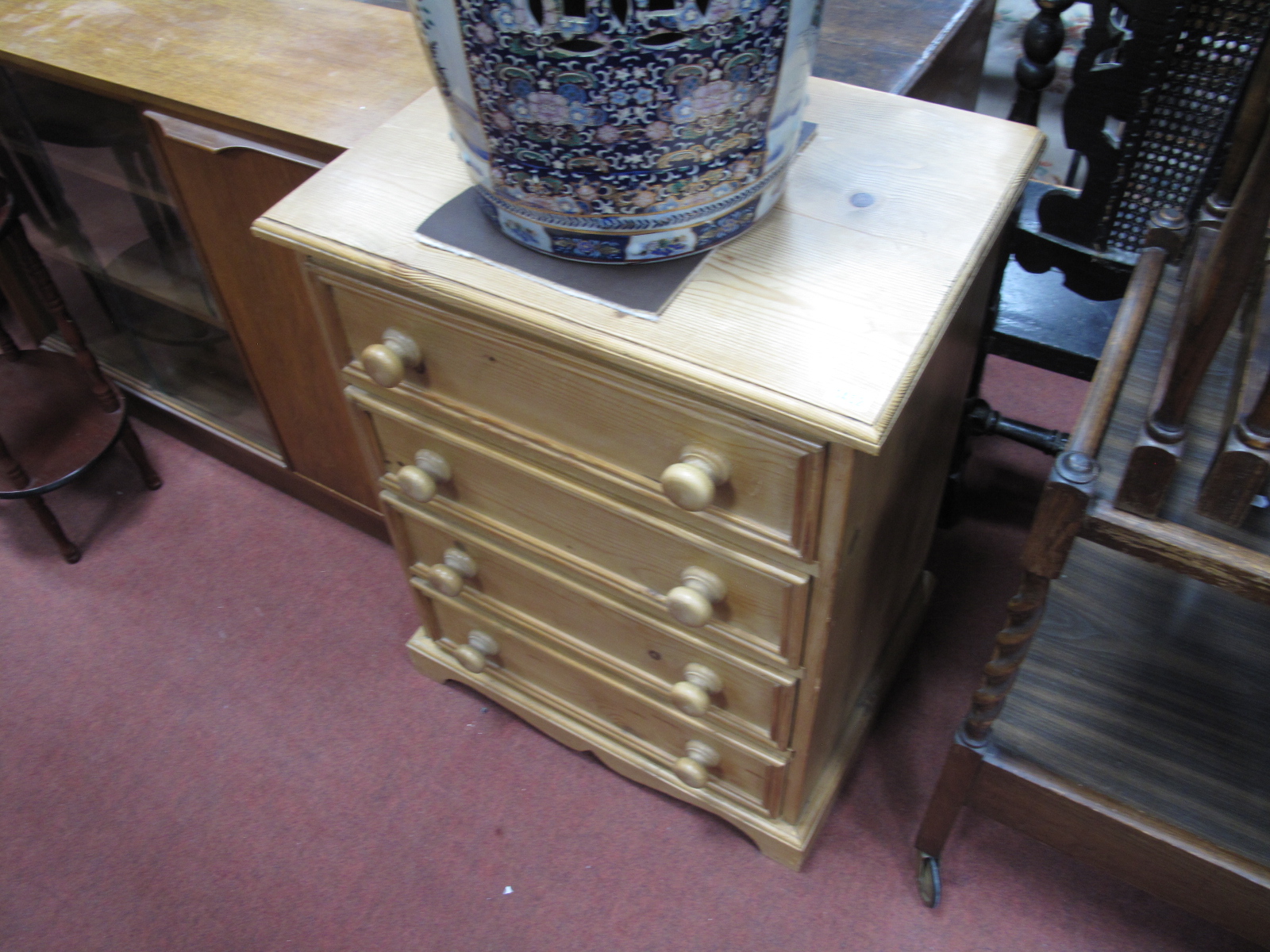 A Pine Chest of Four Drawers, having turned handles, 61cm wide.