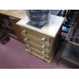 A Pine Chest of Four Drawers, having turned handles, 61cm wide.