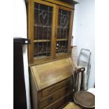 An Early XX Century Oak Bureau Bookcase, with leaded glazed doors, fall front, fitted interior,