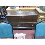 A XVIII Century Oak Mule Chest, with a hinged lid, two small drawers, on a later base; together with