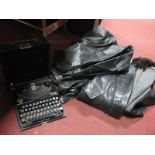 Remington Portable Typewriter; Burton and other leather coat.