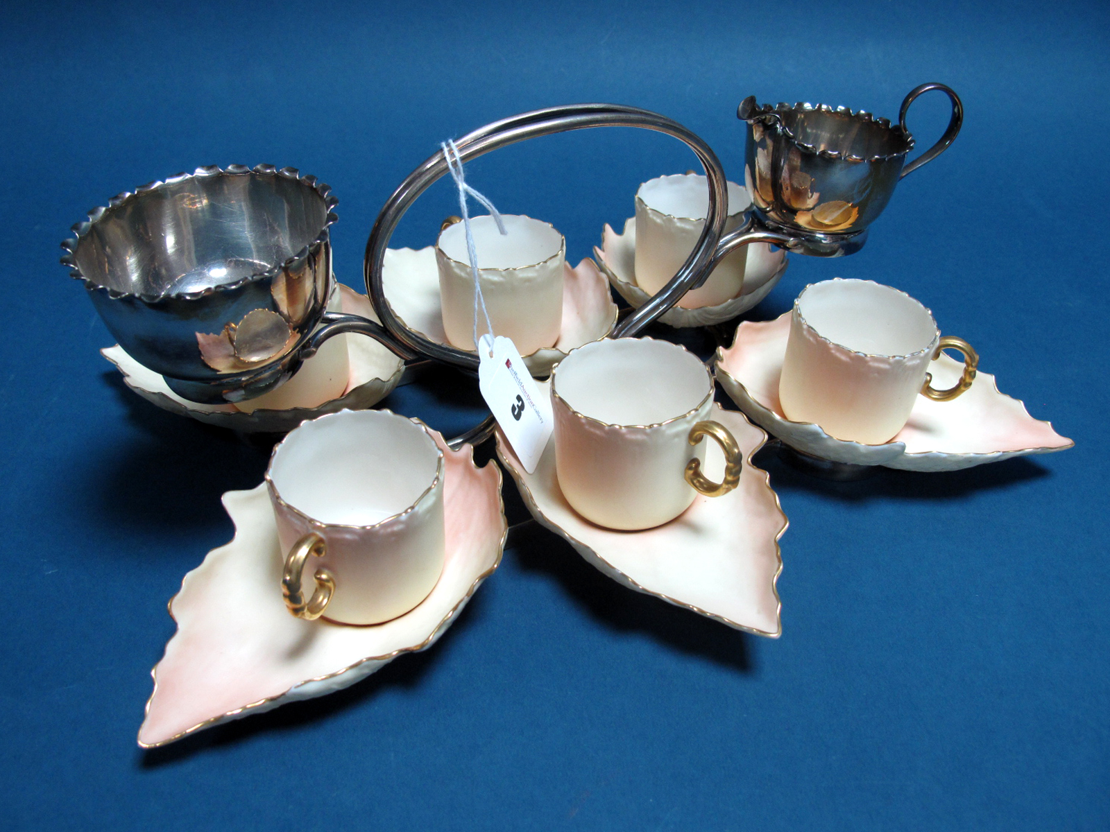 A c.Early XX Century Hukin & Heath Demitasse Set of Six Cups and Saucers, the blush ivory