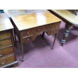 A George IV Style Mahogany Dressing Table, with central drawer, flanking drawers, on square legs,