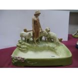 A Royal Dux Pottery Centrepiece Bowl, modelled as a girl standing before a fence with four sheep,