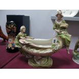 A Large Royal Dux Centrepiece Bowl, modelled as two maidens climbing upon a large shell, upon a