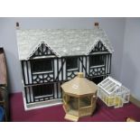 A Large Modern Dolls House, in the form of a mock tudor house, double fronted with six rooms,