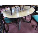 A XIX Century Mahogany Occasional Table, with oval top, reeded edge, on turned pedestal with splayed