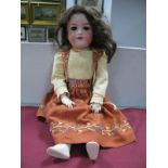 A Bisque Headed Doll, the head stamped "Armand Marseille/390n/DRGM246/1/A3M", with sleepy eyes and