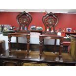 A Pair of XIX Century Oak Hall Chairs, with shaped and carved back, shaped seat, on turned and