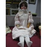 An Early XX Century Large Bisque Headed Doll, the head stamped "Germany, Max Handwerck", with sleepy