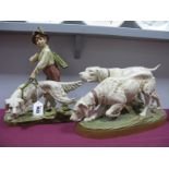 A Royal Dux Model of a Boy Holding a Retriever on a Lead, upon a naturalistic rectangular base,