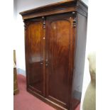 A XIX Century Mahogany Wardrobe, with stepped cornice, twin panelled doors with internal drawers, on