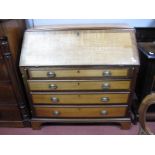 A Late XVIII Century Oak and Mahogany Bureau, with blind fretwork, fitted interior, fall front